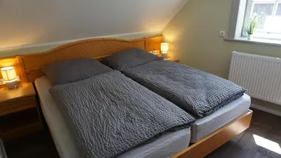 Ein Bett oder Betten in einem Zimmer der Unterkunft Altstadtperle Wernigerode