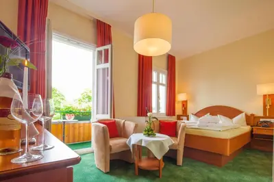 Ein Bett oder Betten in einem Zimmer der Unterkunft Hotel Victoria