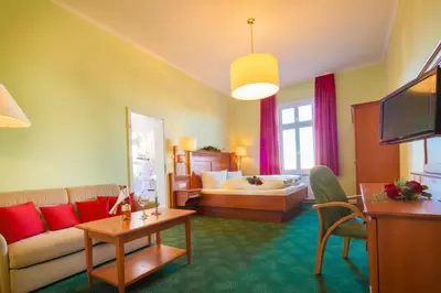 Ein Bett oder Betten in einem Zimmer der Unterkunft Hotel Victoria