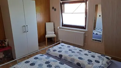 Ein Bett oder Betten in einem Zimmer der Unterkunft Ferienwohnung Friedrichsruh