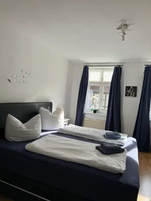 Ein Bett oder Betten in einem Zimmer der Unterkunft Ferienwohnung Agora inkl Parkplatz