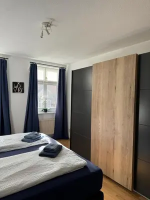 Ein Bett oder Betten in einem Zimmer der Unterkunft Ferienwohnung Agora inkl Parkplatz