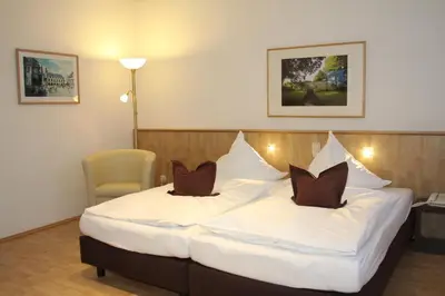 Ein Bett oder Betten in einem Zimmer der Unterkunft Hotel Die Tanne