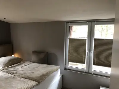 Ein Bett oder Betten in einem Zimmer der Unterkunft Ferienhaus Enno
