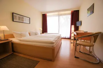 Ein Bett oder Betten in einem Zimmer der Unterkunft Pension Winkel