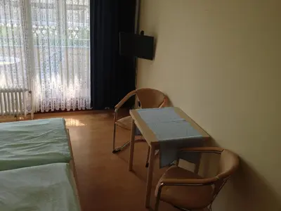 Ein Bett oder Betten in einem Zimmer der Unterkunft Pension Winkel