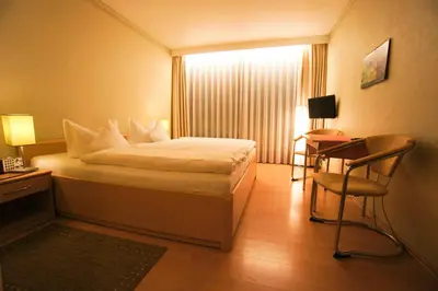 Ein Bett oder Betten in einem Zimmer der Unterkunft Pension Winkel