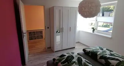 Ein Bett oder Betten in einem Zimmer der Unterkunft Ferienwohnung Am Gondelteich