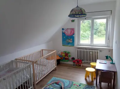 Ein Bett oder Betten in einem Zimmer der Unterkunft Haus Löwenzahn