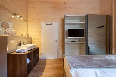 Ein Bett oder Betten in einem Zimmer der Unterkunft Bergwaldsuites