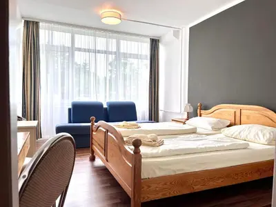 Ein Bett oder Betten in einem Zimmer der Unterkunft Landhotel Harz
