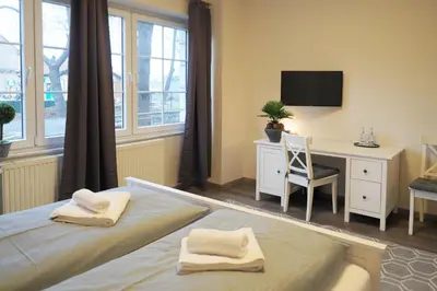 Ein Bett oder Betten in einem Zimmer der Unterkunft REGIOHOTEL Quedlinburger Hof - #HistorischerCharme #ZentraleLage #Wellness #FreeParking