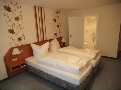 Ein Bett oder Betten in einem Zimmer der Unterkunft Hotel Engel Altenau