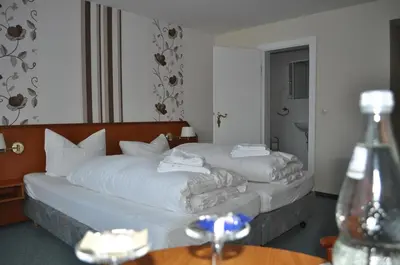 Ein Bett oder Betten in einem Zimmer der Unterkunft Hotel Engel Altenau