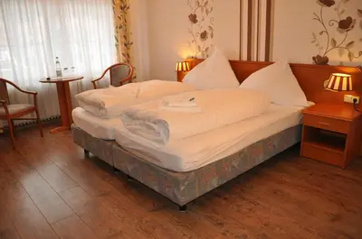 Ein Bett oder Betten in einem Zimmer der Unterkunft Hotel Engel Altenau