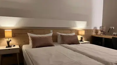 Ein Bett oder Betten in einem Zimmer der Unterkunft Harz hotel Iris