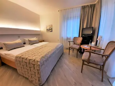 Ein Bett oder Betten in einem Zimmer der Unterkunft Harz hotel Iris