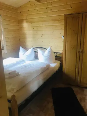 Ein Bett oder Betten in einem Zimmer der Unterkunft Blockhaus Harzblick4C