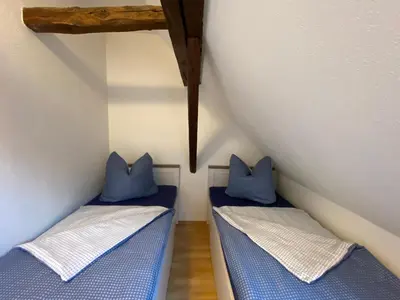 Ein Bett oder Betten in einem Zimmer der Unterkunft Urlaub in der Welterbestadt Quedlinburg