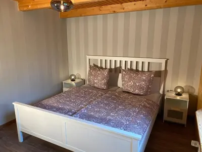 Ein Bett oder Betten in einem Zimmer der Unterkunft Lodge am Wald Terrasse Garten Grill ruhige Lage Wandern