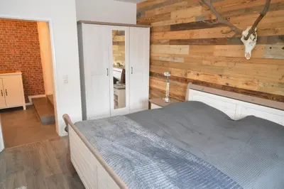 Ein Bett oder Betten in einem Zimmer der Unterkunft Harzfeuer Bergblick