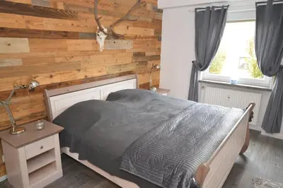 Ein Bett oder Betten in einem Zimmer der Unterkunft Harzfeuer Bergblick