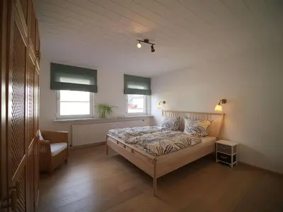 Ein Bett oder Betten in einem Zimmer der Unterkunft Ferienhaus im Bergdorf