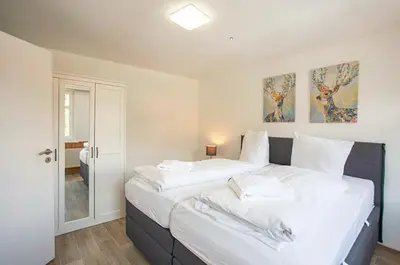 Ein Bett oder Betten in einem Zimmer der Unterkunft Ferienhaus an der Brockenbahn