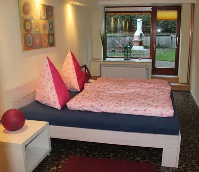 Ein Bett oder Betten in einem Zimmer der Unterkunft Waldhaus Hahnenklee