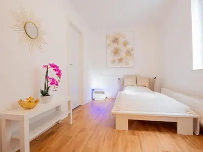 Ein Bett oder Betten in einem Zimmer der Unterkunft EUPHORAS - Top ausgestattete Ferienwohnung mit 105 qm und 3 Schlafzimmern