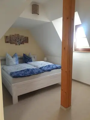Ein Bett oder Betten in einem Zimmer der Unterkunft FW Zum Kuckucksnest auf 2 Etagen und 140qm