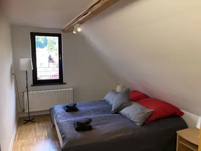 Ein Bett oder Betten in einem Zimmer der Unterkunft Ferienhaus Art Apartment - Harz