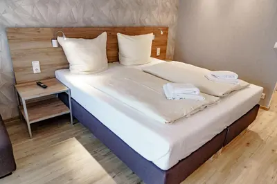 Ein Bett oder Betten in einem Zimmer der Unterkunft Haus am See Luxury HS 224 B