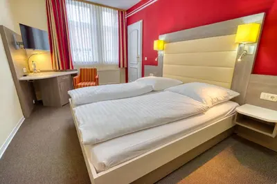 Ein Bett oder Betten in einem Zimmer der Unterkunft Hotel Goldene Krone
