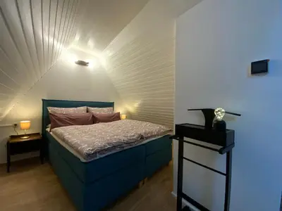 Ein Bett oder Betten in einem Zimmer der Unterkunft Suite Apartment Quedlinburg Schlosspfad
