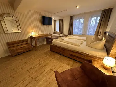 Ein Bett oder Betten in einem Zimmer der Unterkunft Hotel Zur Goldenen Sonne