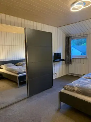 Ein Bett oder Betten in einem Zimmer der Unterkunft Ferienwohnung am Rothenberg