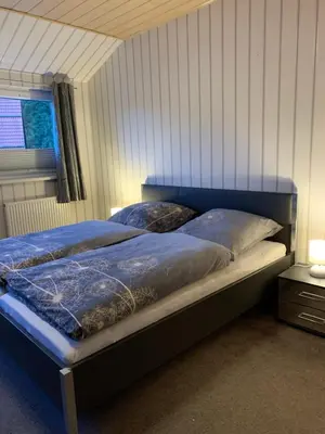 Ein Bett oder Betten in einem Zimmer der Unterkunft Ferienwohnung am Rothenberg