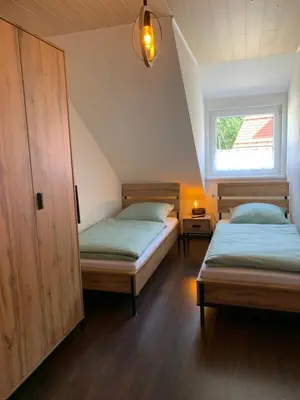 Ein Bett oder Betten in einem Zimmer der Unterkunft Ferienwohnung am Rothenberg