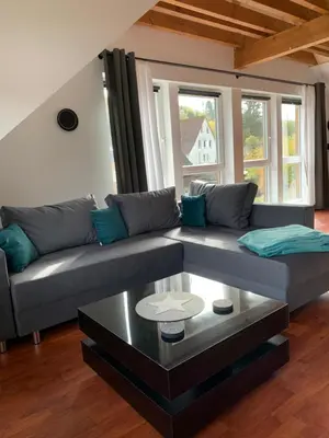 Ein Sitzbereich in der Unterkunft Ferienwohnung am Rothenberg