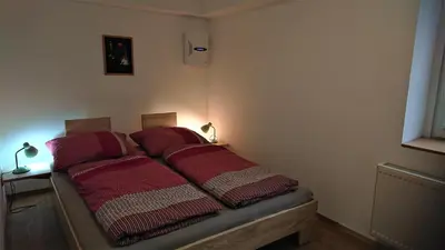 Ein Bett oder Betten in einem Zimmer der Unterkunft Ferienwohnung Wäldle