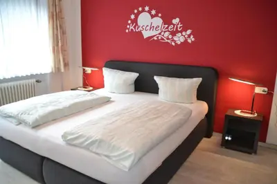Ein Bett oder Betten in einem Zimmer der Unterkunft Landhotel Kunzental