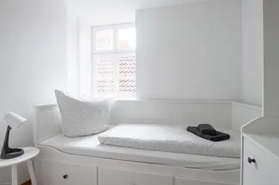 Ein Bett oder Betten in einem Zimmer der Unterkunft Ferienwohnungen BUNTER HOF Quedlinburg