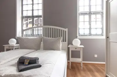 Ein Bett oder Betten in einem Zimmer der Unterkunft Ferienwohnungen BUNTER HOF Quedlinburg