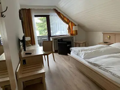 Ein Bett oder Betten in einem Zimmer der Unterkunft Ferienwohnung Wiesenblick mit Terrasse im Landhaus Fischer