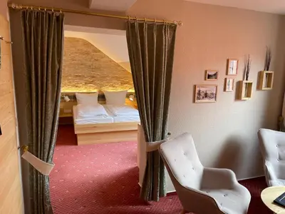 Ein Bett oder Betten in einem Zimmer der Unterkunft Vitalhotel Sonneneck