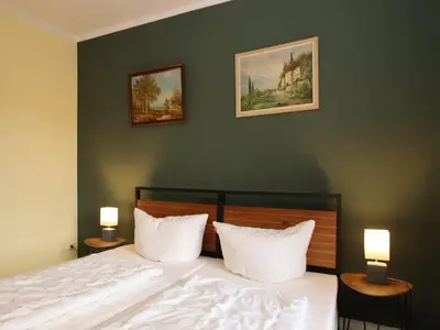 Ein Bett oder Betten in einem Zimmer der Unterkunft Ferienwohnung mit weitem Ausblick in Altenau