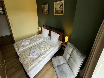 Ein Bett oder Betten in einem Zimmer der Unterkunft Ferienwohnung mit weitem Ausblick in Altenau