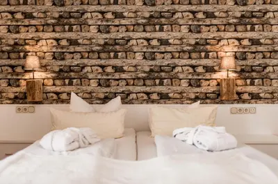 Ein Bett oder Betten in einem Zimmer der Unterkunft Parkhotel Weber-Müller