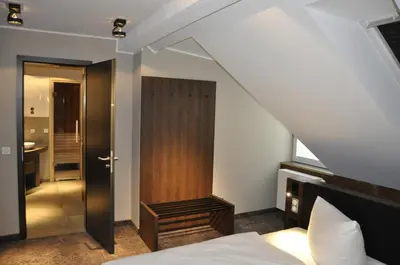 Ein Bett oder Betten in einem Zimmer der Unterkunft StrandBerg's Designhotel Viktoria
